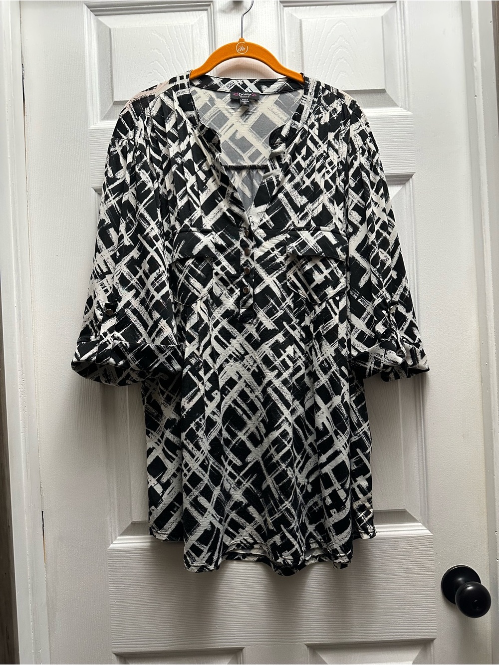 Cocomo Wonen’s Abstract Black & White V-Neck Blouse with Silver Buttons